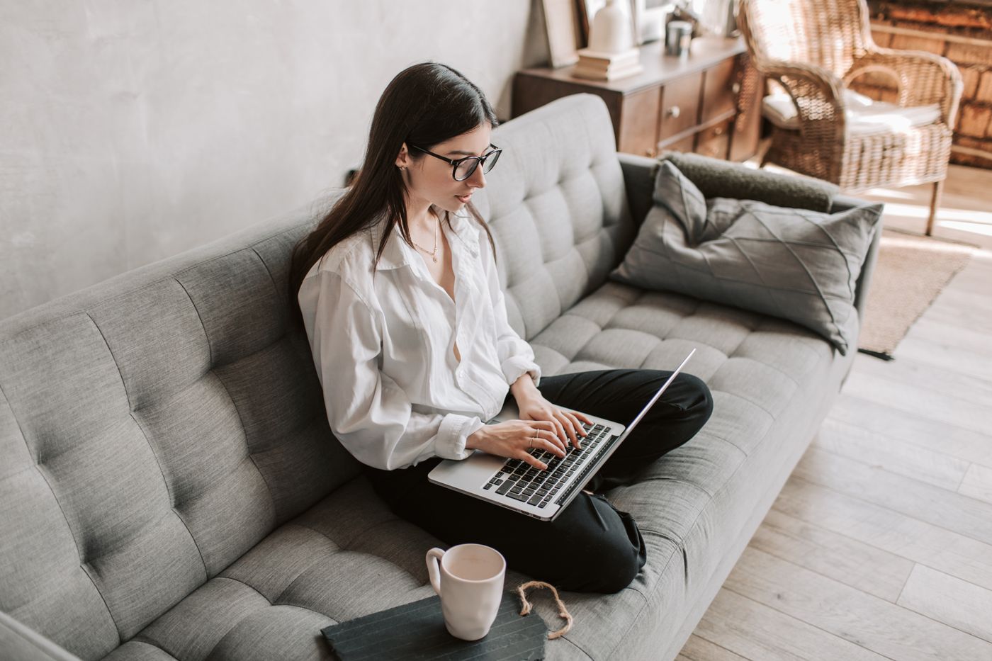 A professional working on a laptop from home